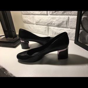 Black pumps with silver accents. Gently worn.